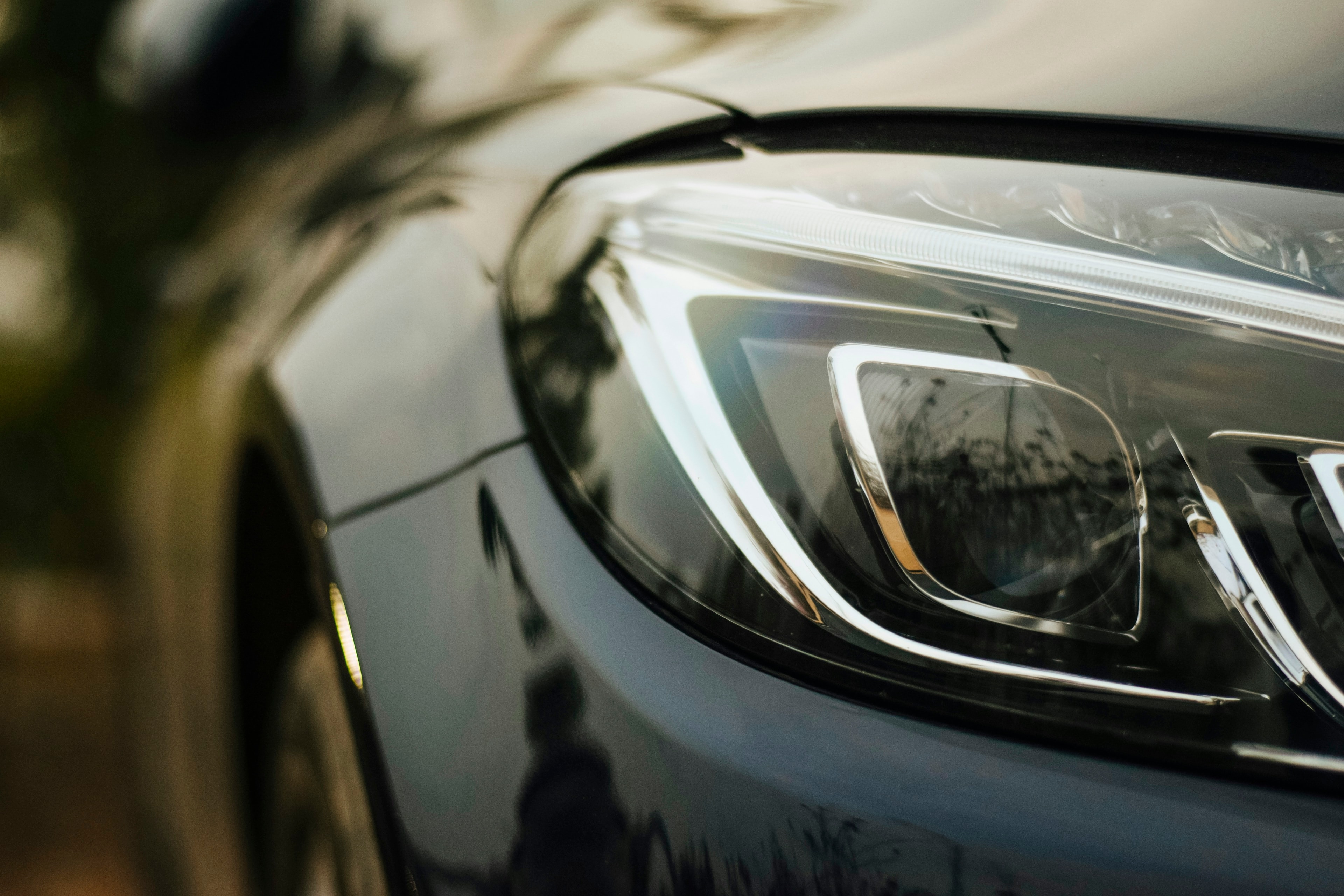 Modern headlight close-up: ADAS Camera Recalibration, Blue Chip Auto Glass