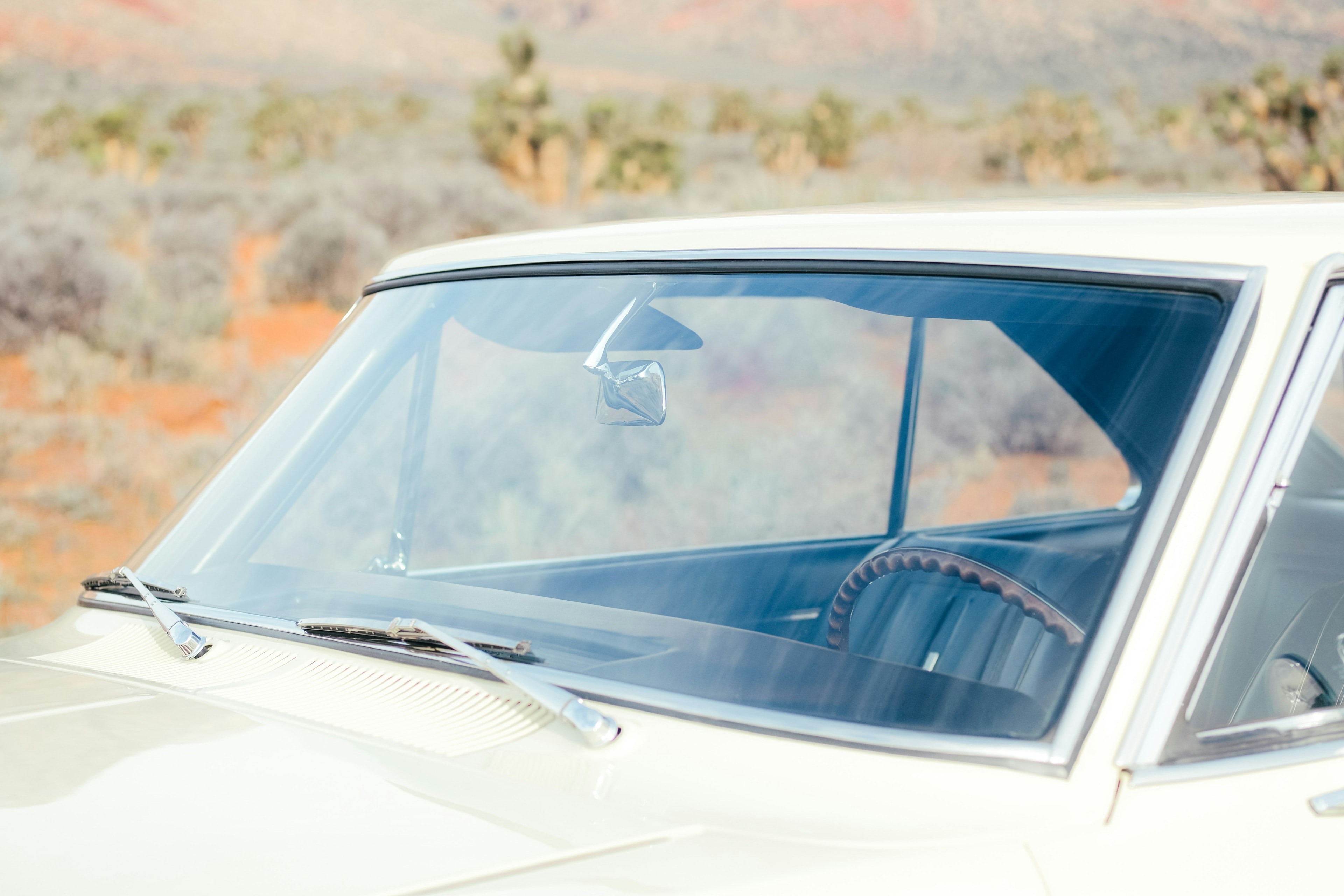 Classic white car windshield in sunlight: Auto Glass Replacement, Blue Chip Auto Glass