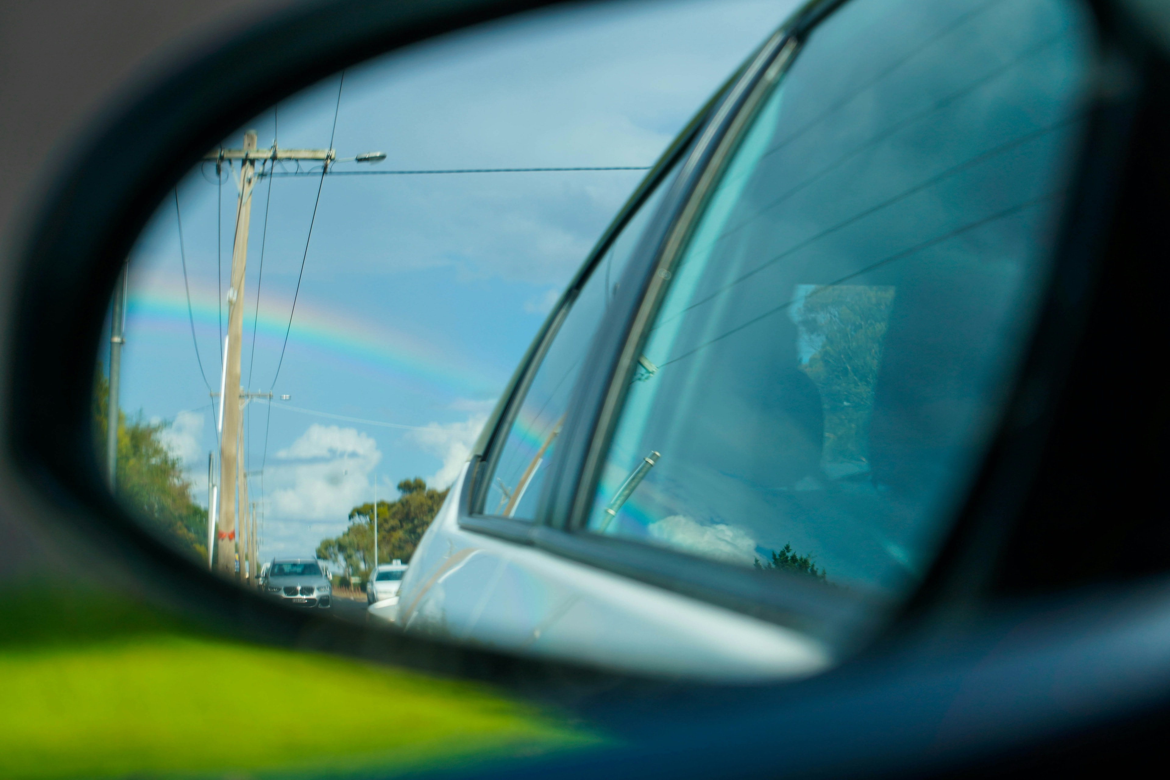 Mirror with sky and rainbow reflection: I think that I have auto glass coverage. Is there any way to verify this without calling my agent?, Blue Chip Auto Glass