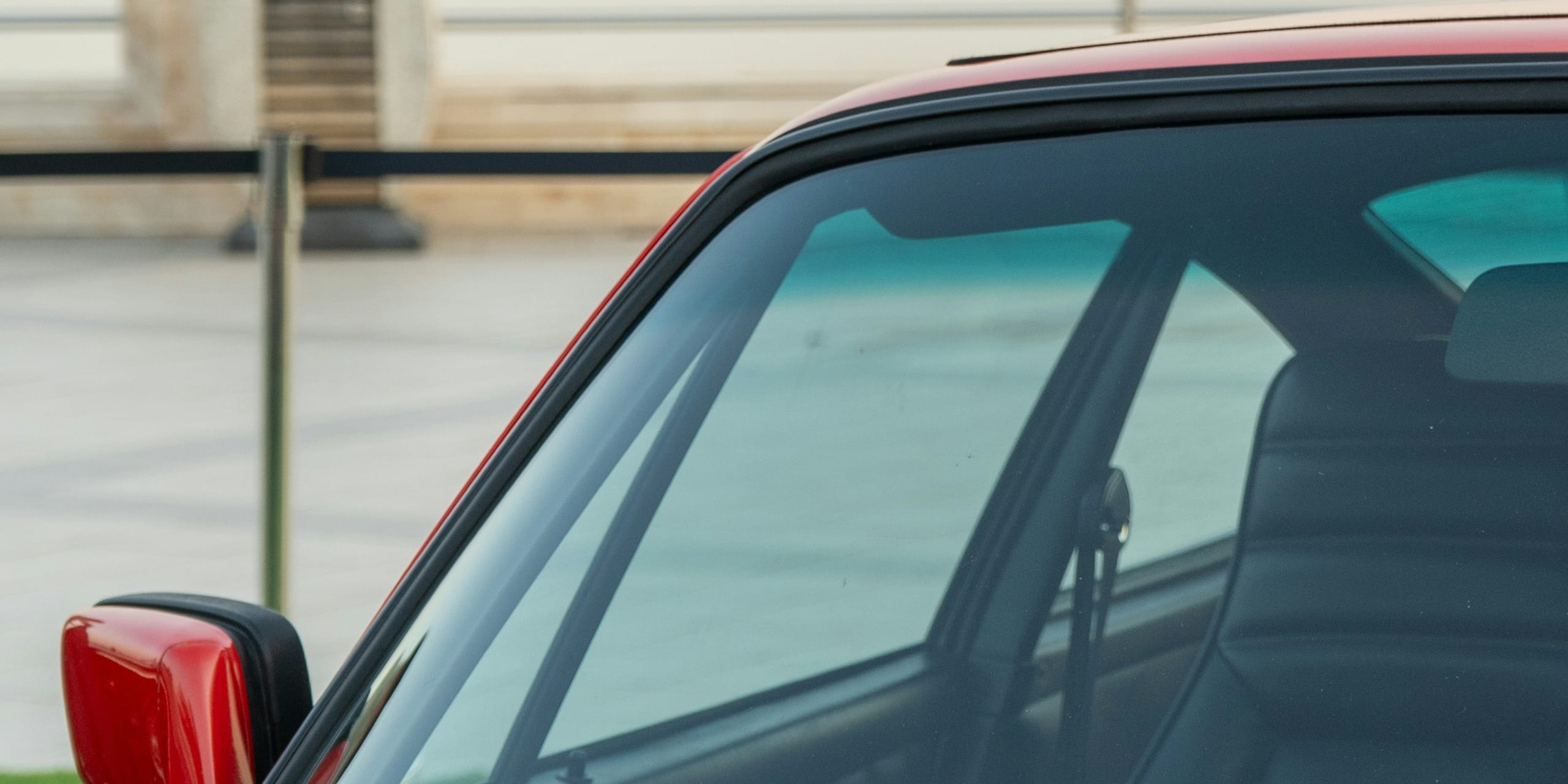 Red sports car windshield close-up: Not all Glass is Created Equal, Blue Chip Auto Glass
