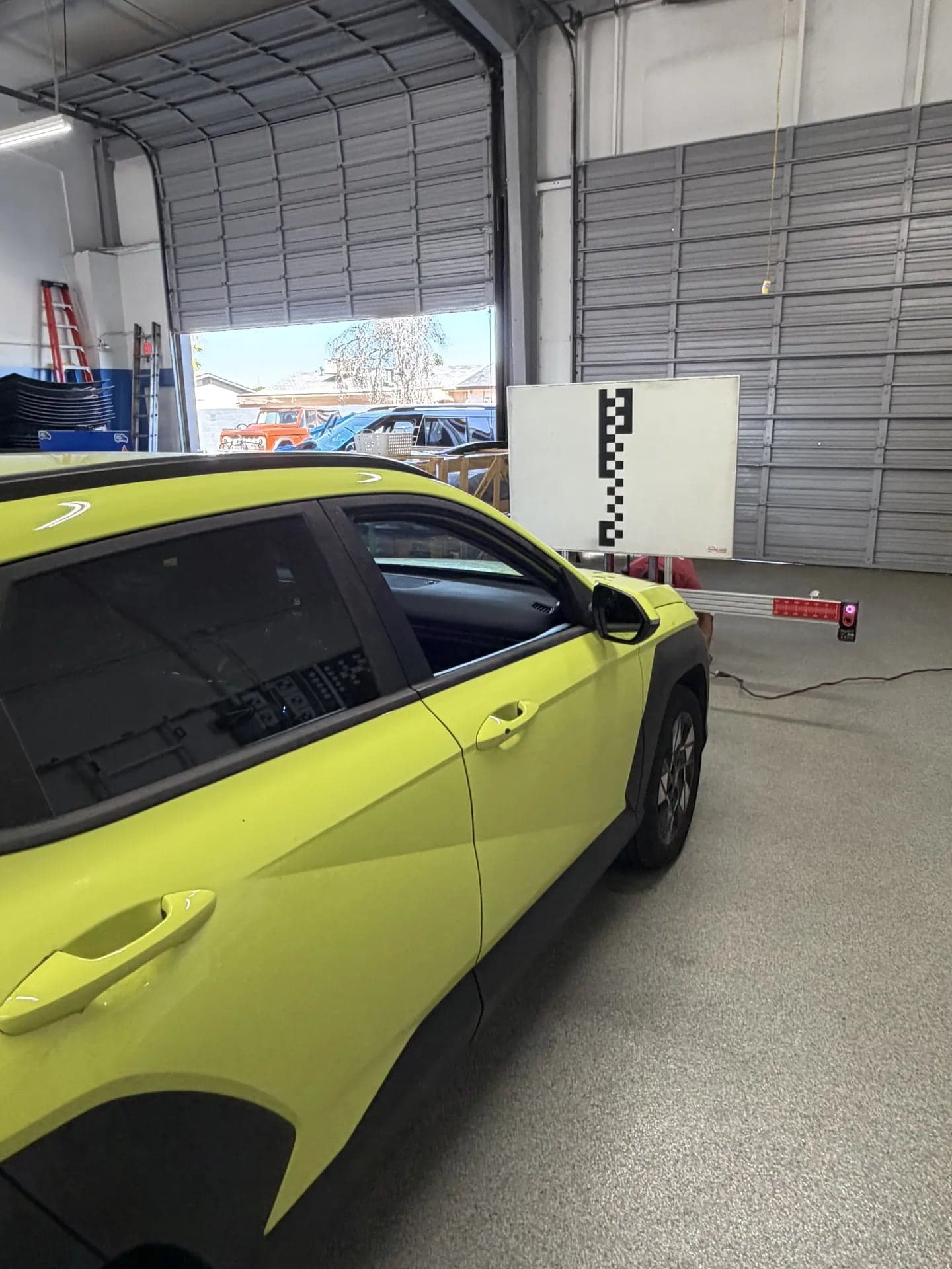 Hyundai Kona in front of a calibration target board