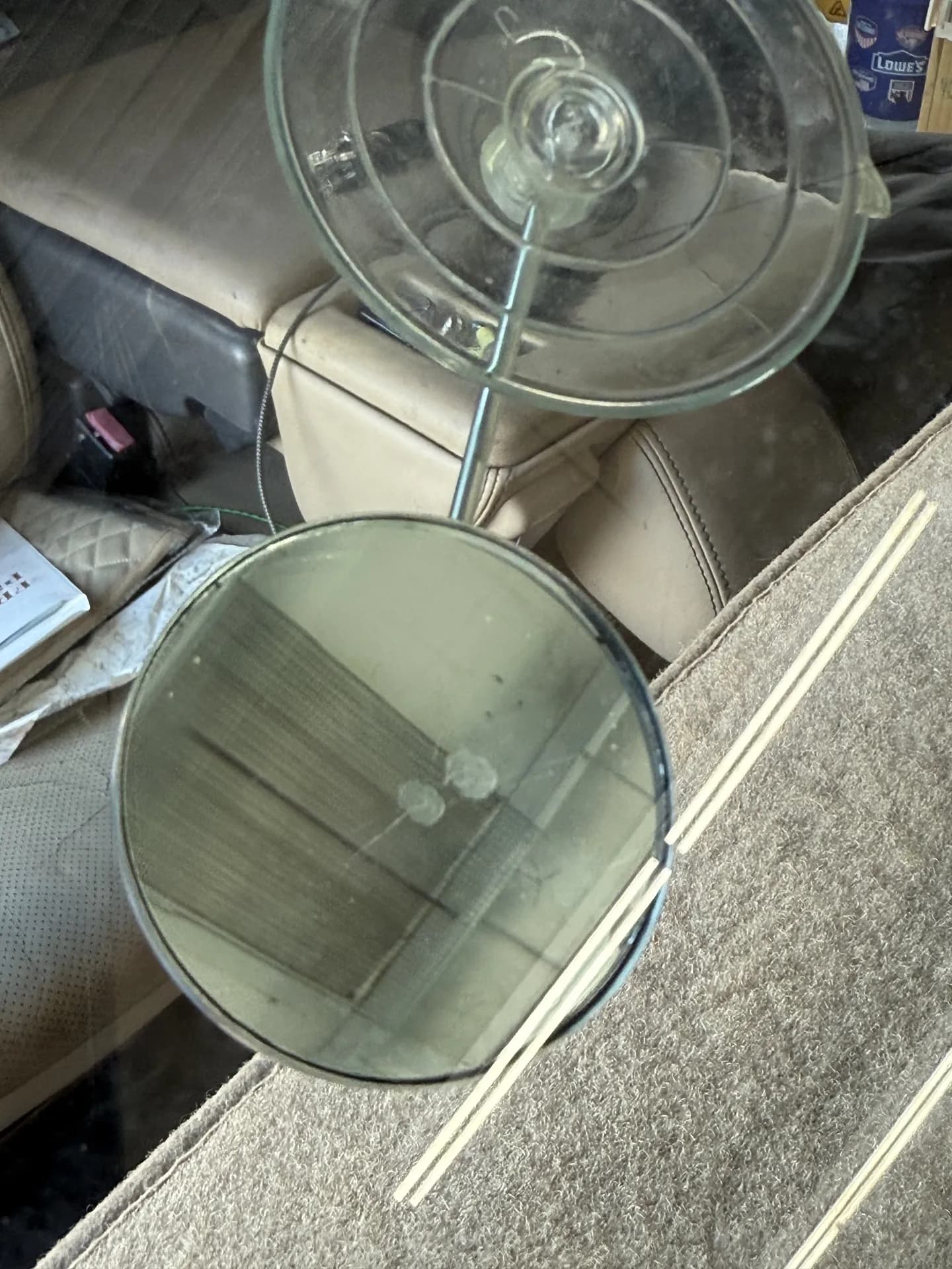 The same windshield chip after repair, filled and much less visible