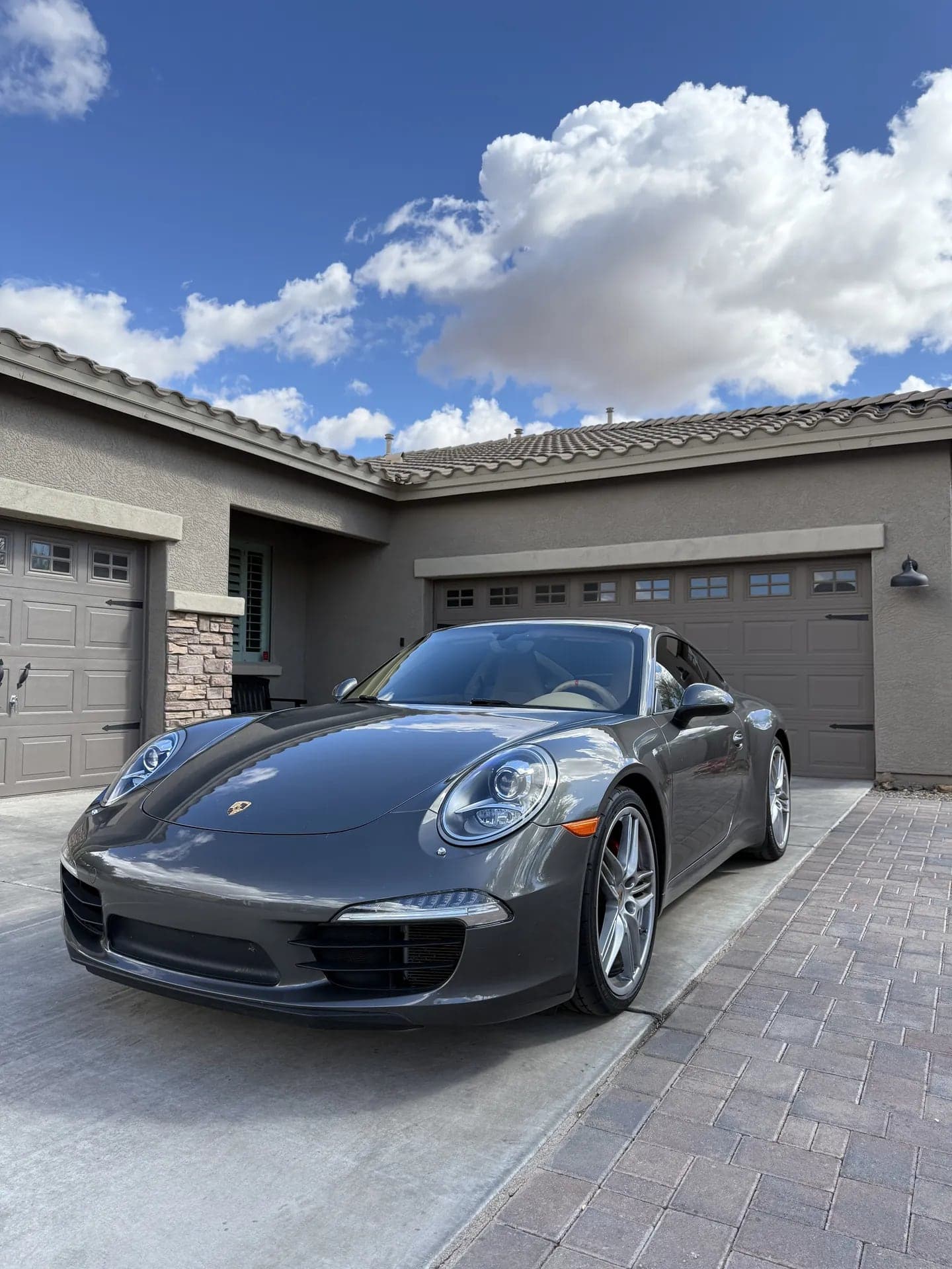 Grey Porsche 911 after mobile glass service