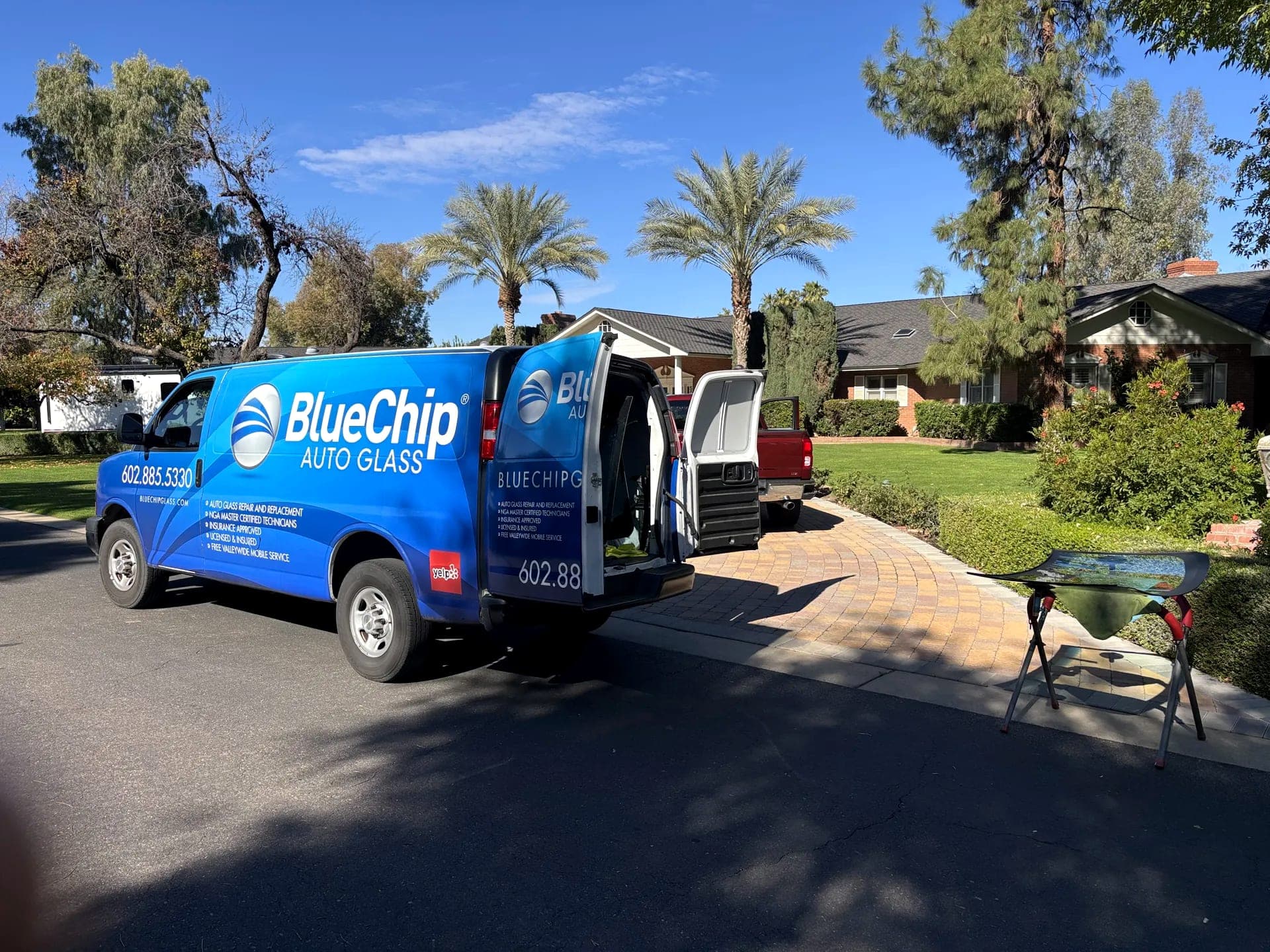 Blue Chip Auto Glass van parked at a customer's home in Phoenix