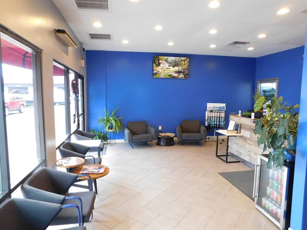 Bright Phoenix shop lobby with lounge chairs and a blue accent wall