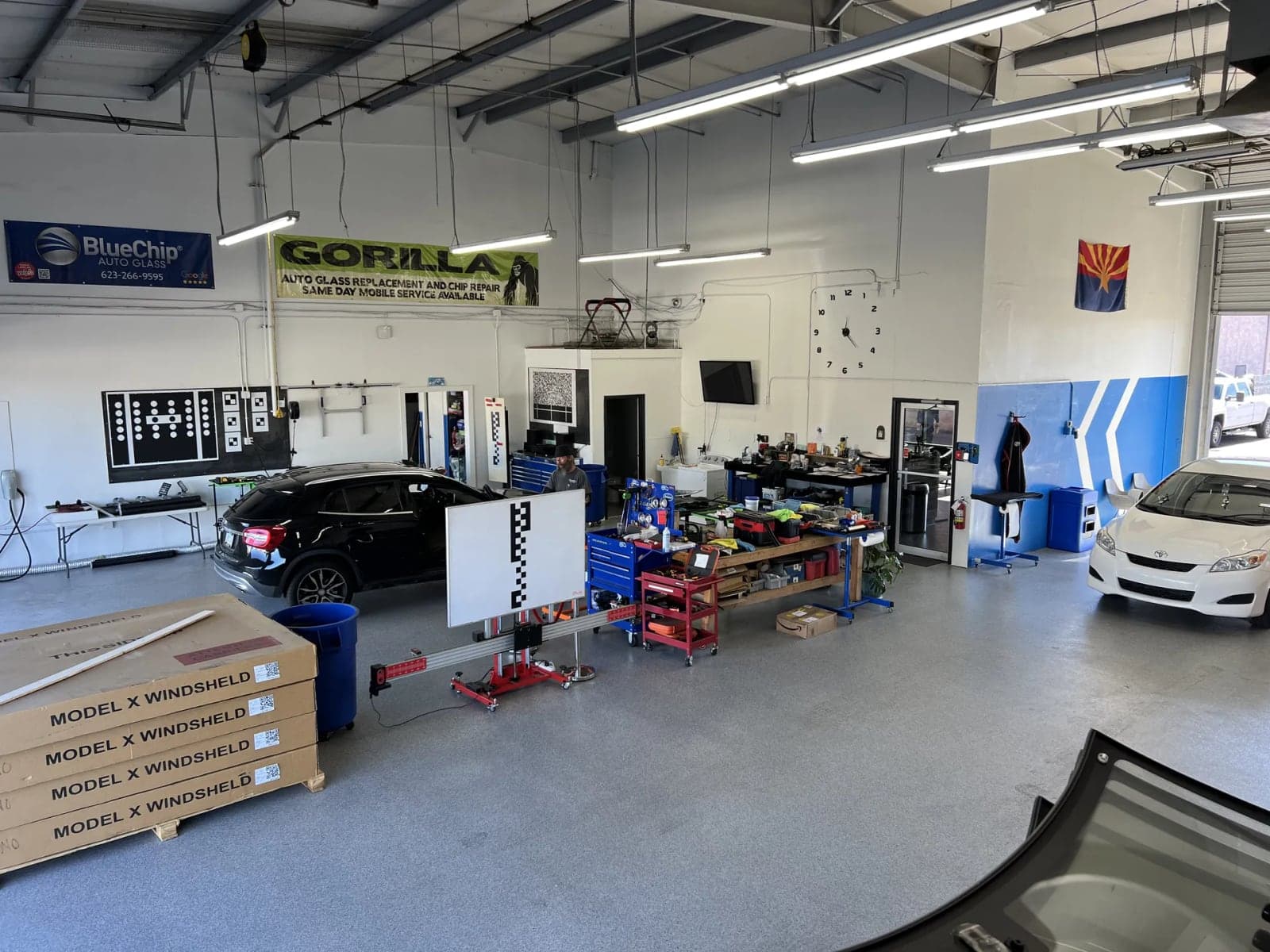 Wide view of the Phoenix Blue Chip Auto Glass shop floor and service bays