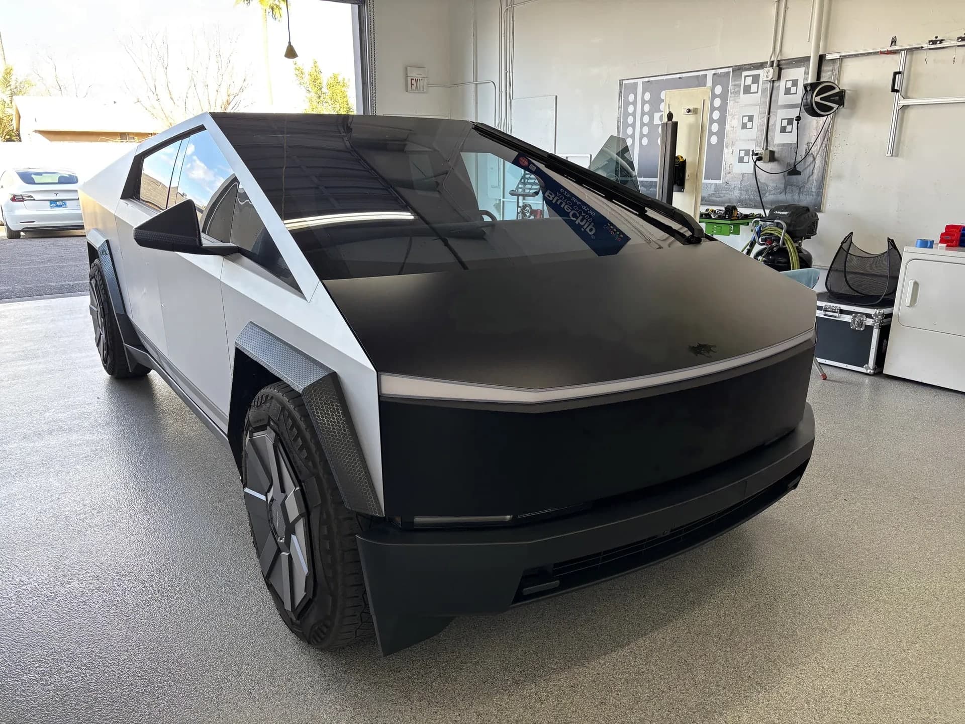 Tesla Cybertruck with a new windshield in the Blue Chip Auto Glass shop